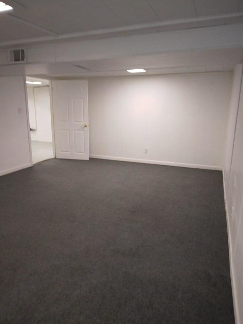 1920 Root Street Crest Hill, IL 60403 - Photo 13 of 17 a view of an empty room and chandelier fan