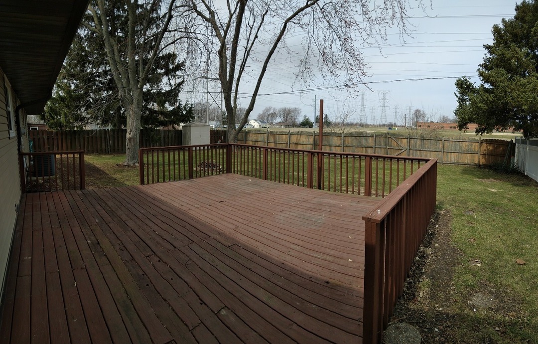 1920 Root Street Crest Hill, IL 60403 - Photo 16 of 17 a view of balcony with wooden floor and trees