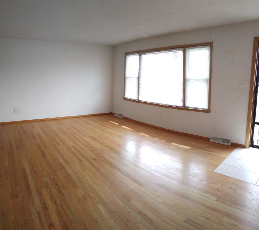 1920 Root Street Crest Hill, IL 60403 - Photo 3 of 17 an empty room with wooden floor and windows