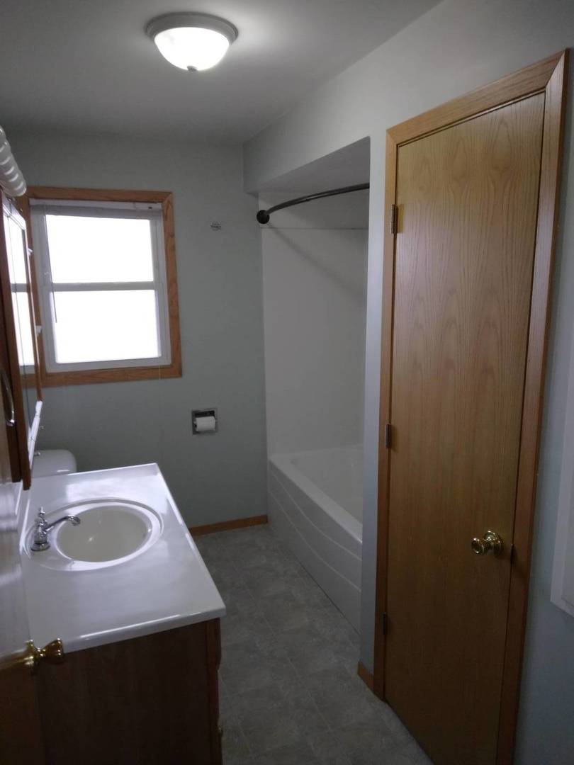 1920 Root Street Crest Hill, IL 60403 - Photo 7 of 17 a bathroom with a sink and a vanity