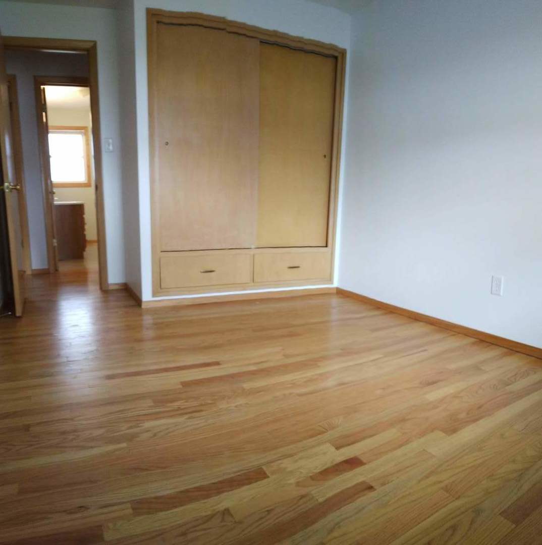1920 Root Street Crest Hill, IL 60403 - Photo 9 of 17 a view of empty room with wooden floor
