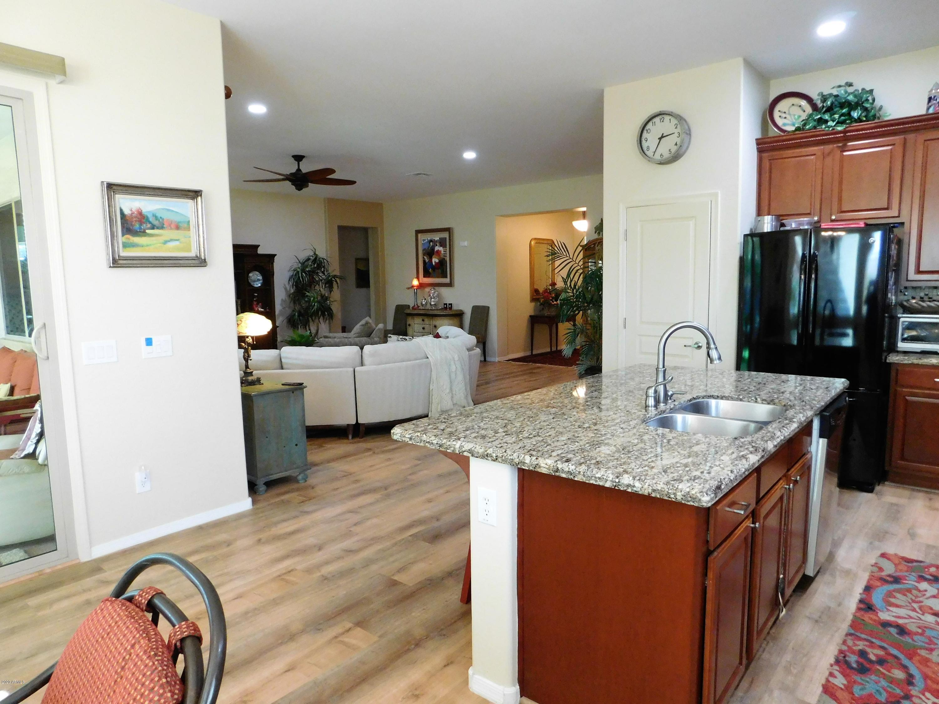 16213 West Berkeley Road Goodyear, AZ 85395 - Photo 5 of 23 kitchen to living