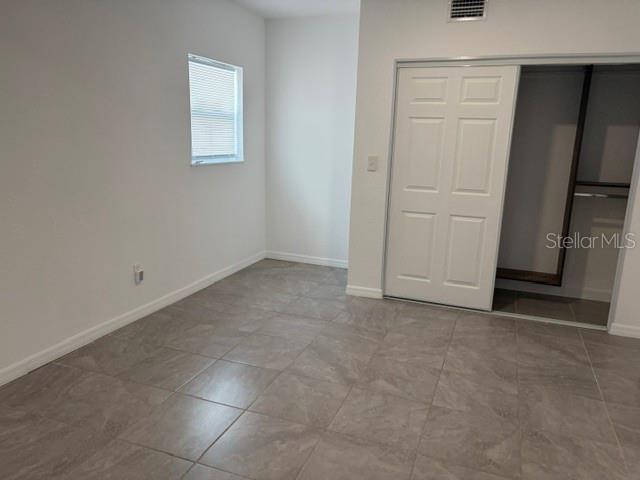 11601 109th Street Seminole, FL 33778 - Photo 16 of 29 an empty room with windows