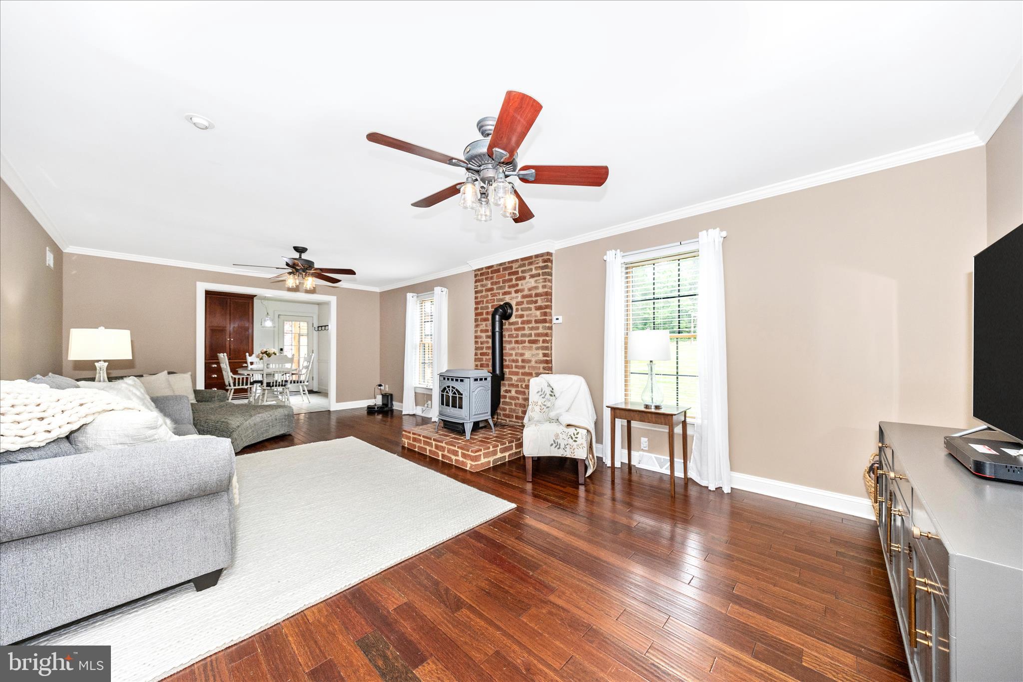 15810 Spade Road Hagerstown, MD 21740 - Photo 13 of 76 a living room with furniture a ceiling fan and a flat screen tv