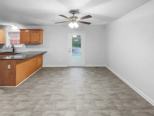 a view of a kitchen with a sink and cabinet