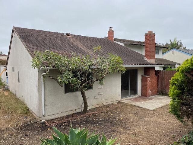 7490 Evergreen Drive Goleta, CA 93117 - Photo 2 of 4 a front view of a house with a yard and garage