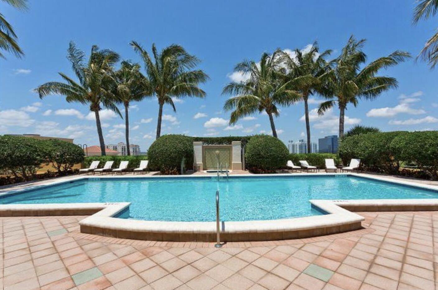 403 South Sapodilla Avenue, Unit 618 West Palm Beach, FL 33401 - Photo 16 of 20 a view of a swimming pool and lounge chair