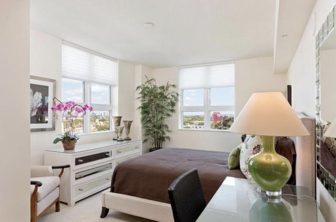 403 South Sapodilla Avenue, Unit 618 West Palm Beach, FL 33401 - Photo 8 of 20 a bedroom with furniture and a large window