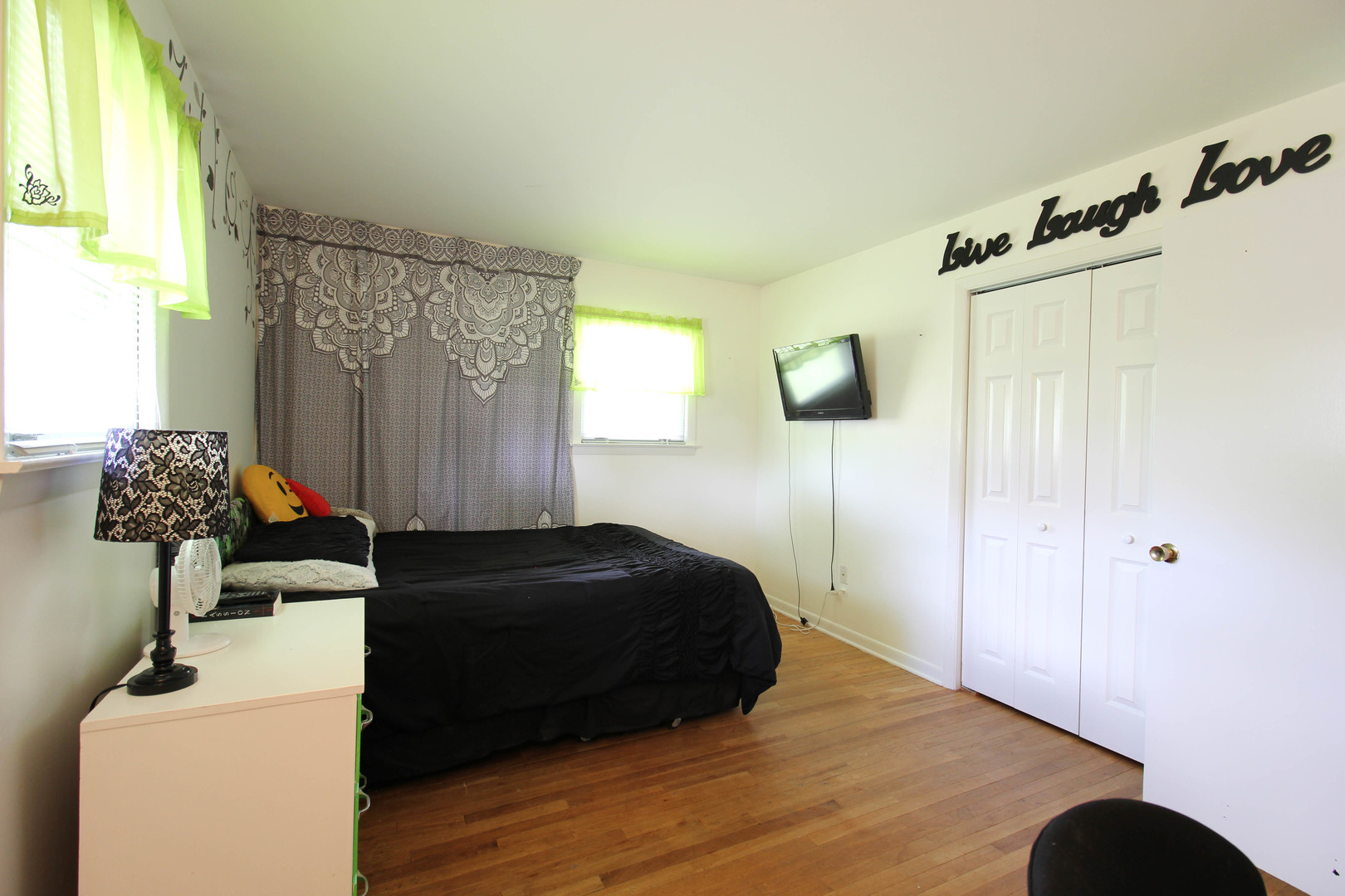 10-s021 Plainfield-Naperville Road Naperville, IL 60565 - Photo 11 of 40 a bedroom with a bed and a chandelier