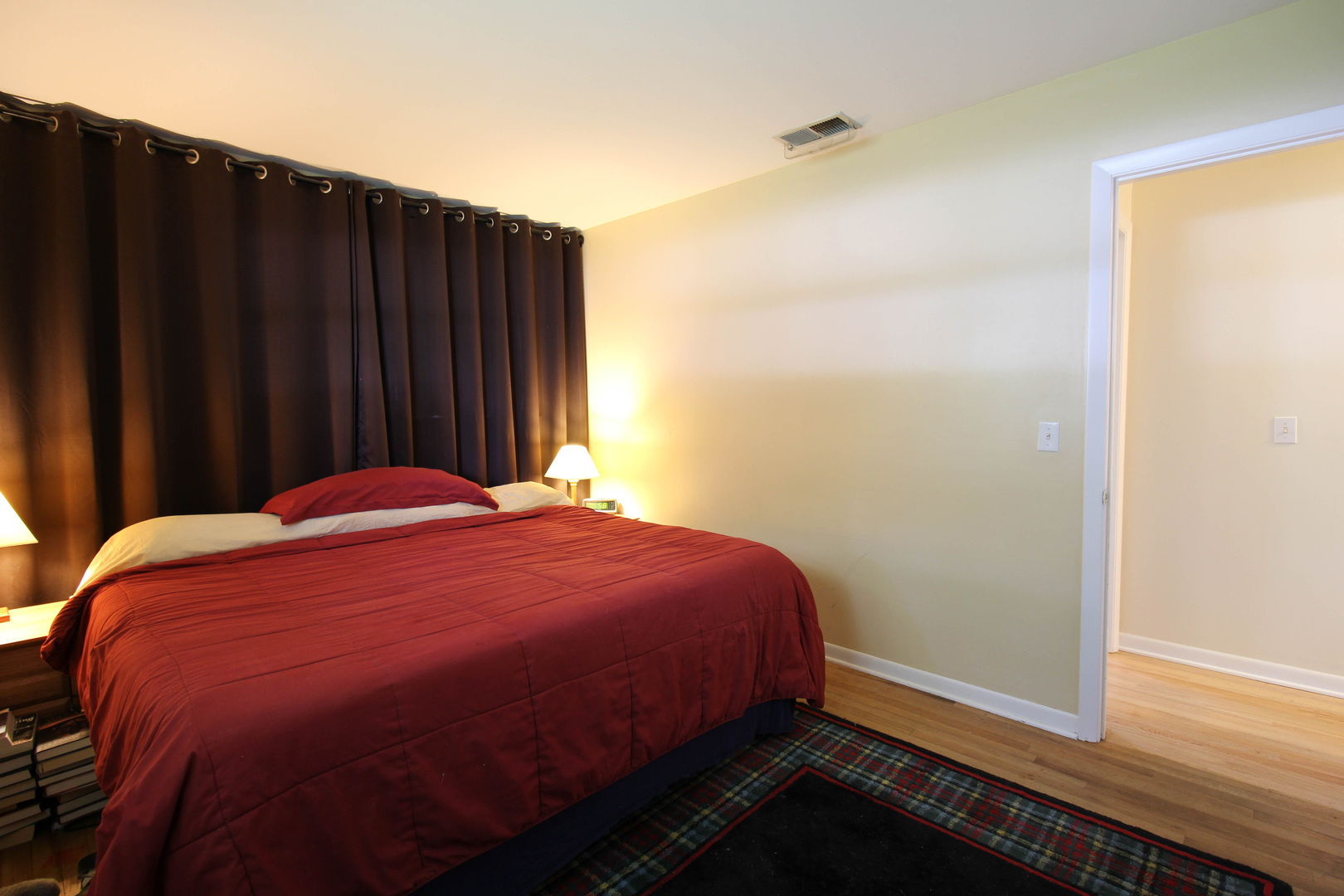 10-s021 Plainfield-Naperville Road Naperville, IL 60565 - Photo 13 of 40 a bed sitting in a bedroom next to a wooden door