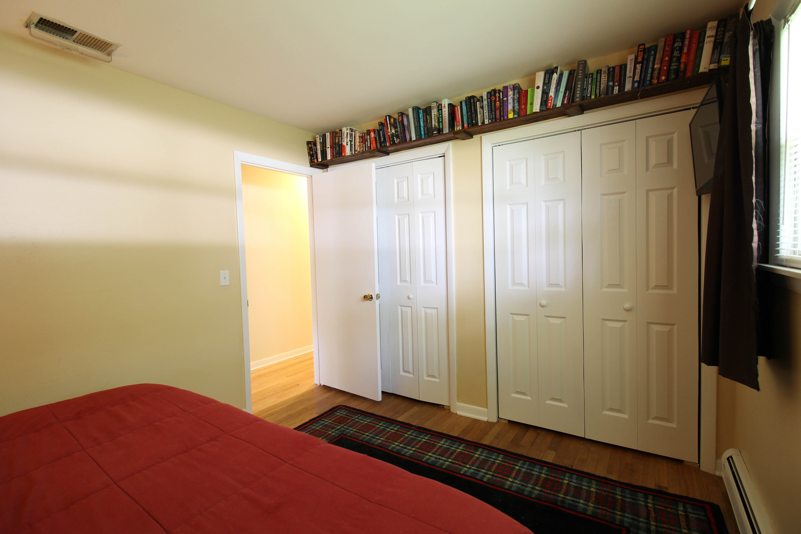 10-s021 Plainfield-Naperville Road Naperville, IL 60565 - Photo 14 of 40 a bedroom with a bed and a book shelf