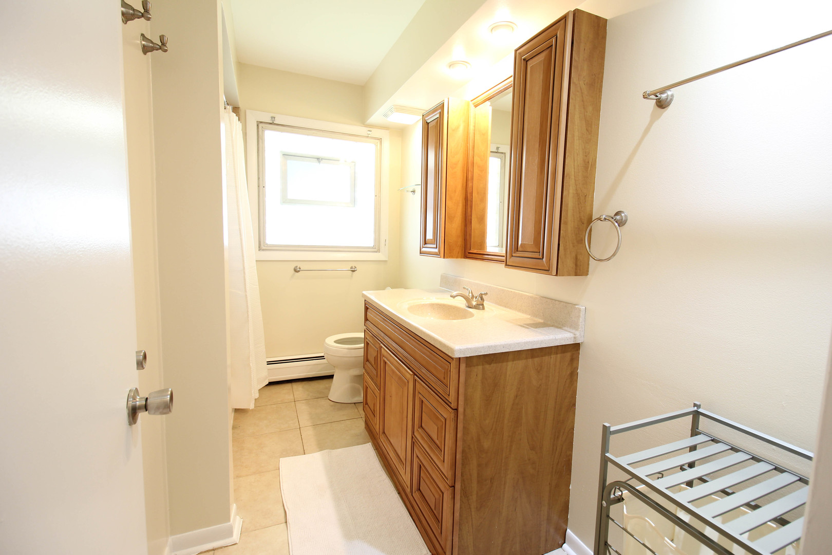 10-s021 Plainfield-Naperville Road Naperville, IL 60565 - Photo 16 of 40 a bathroom with a sink a toilet and a mirror