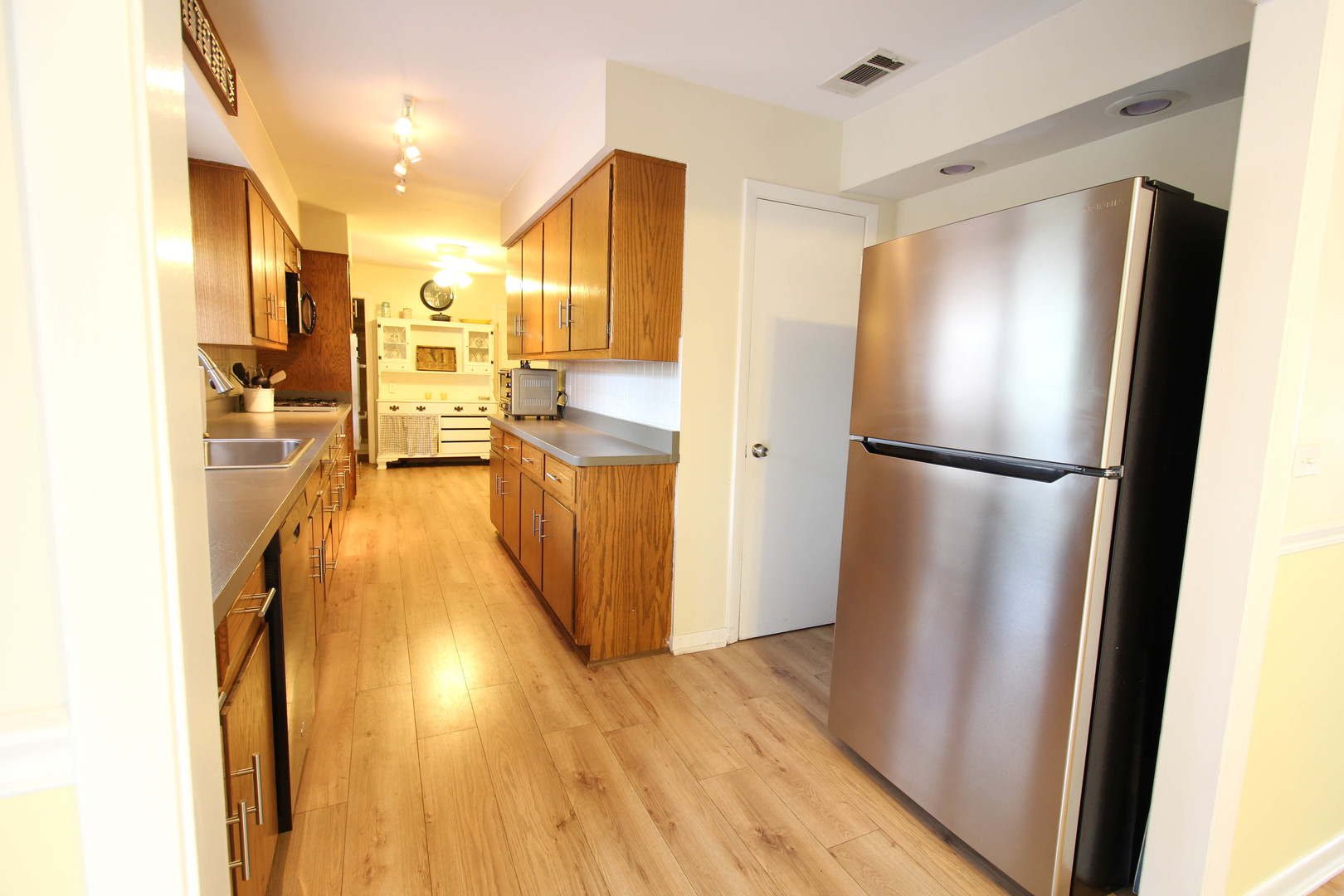 10-s021 Plainfield-Naperville Road Naperville, IL 60565 - Photo 18 of 40 a kitchen with stainless steel appliances a refrigerator and a refrigerator