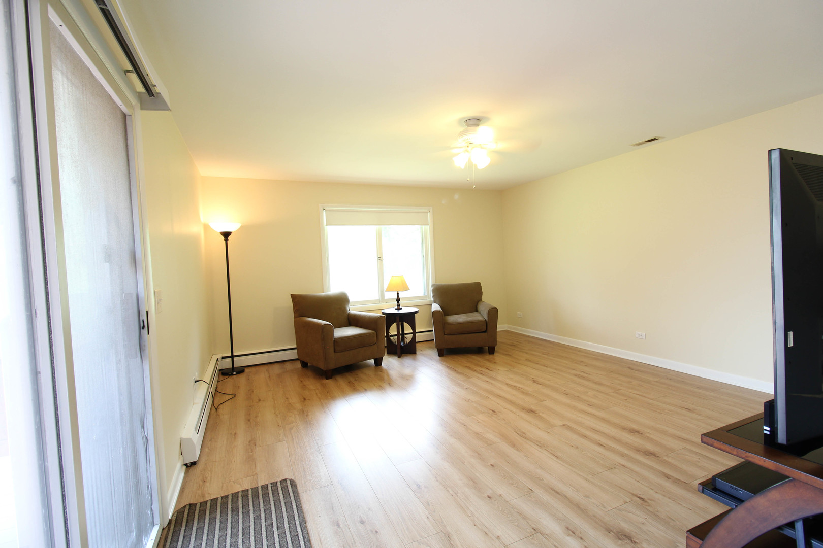 10-s021 Plainfield-Naperville Road Naperville, IL 60565 - Photo 25 of 40 a living room with furniture and a wooden floor