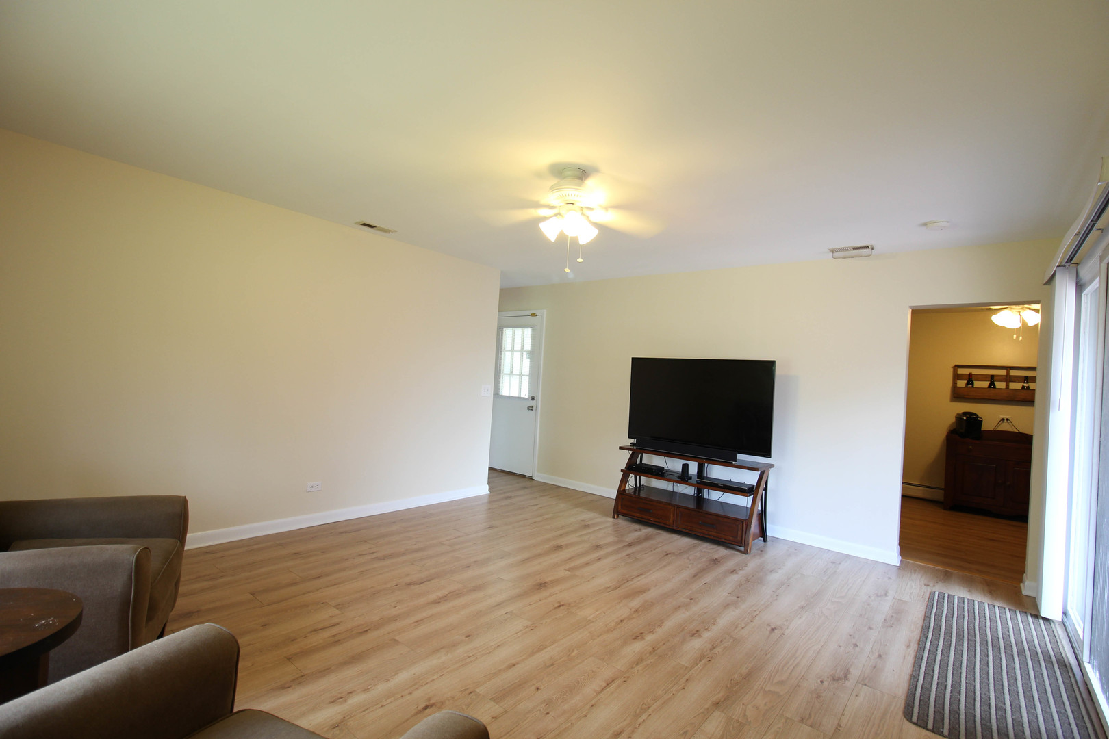 10-s021 Plainfield-Naperville Road Naperville, IL 60565 - Photo 26 of 40 a view of livingroom with furniture and wooden floor