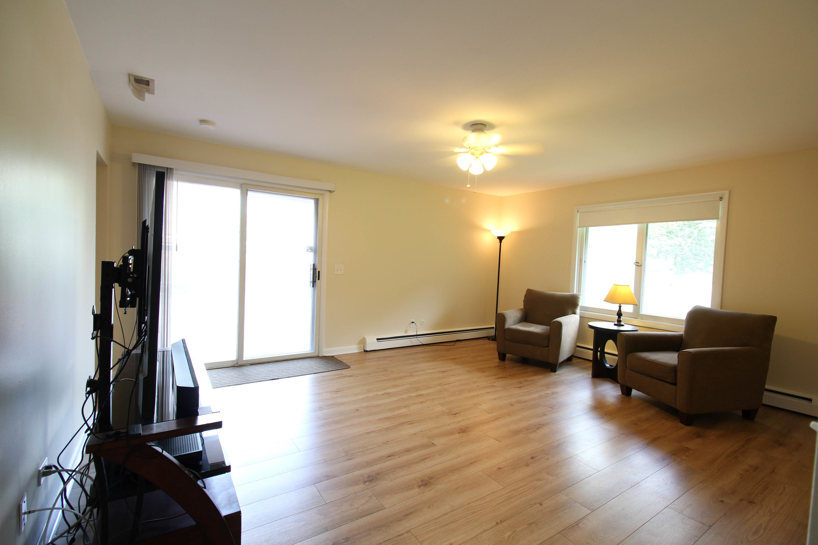 10-s021 Plainfield-Naperville Road Naperville, IL 60565 - Photo 27 of 40 a living room with furniture and a flat screen tv with wooden floor