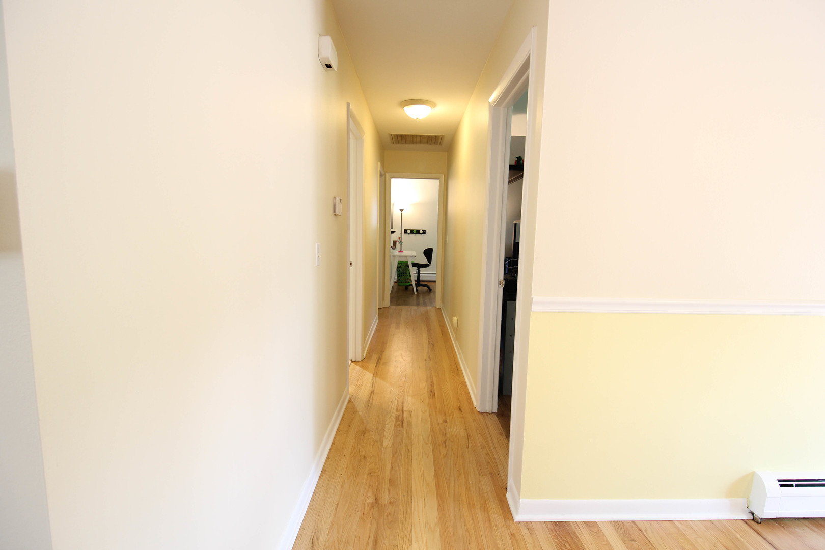 10-s021 Plainfield-Naperville Road Naperville, IL 60565 - Photo 9 of 40 a view of a hallway with wooden floor