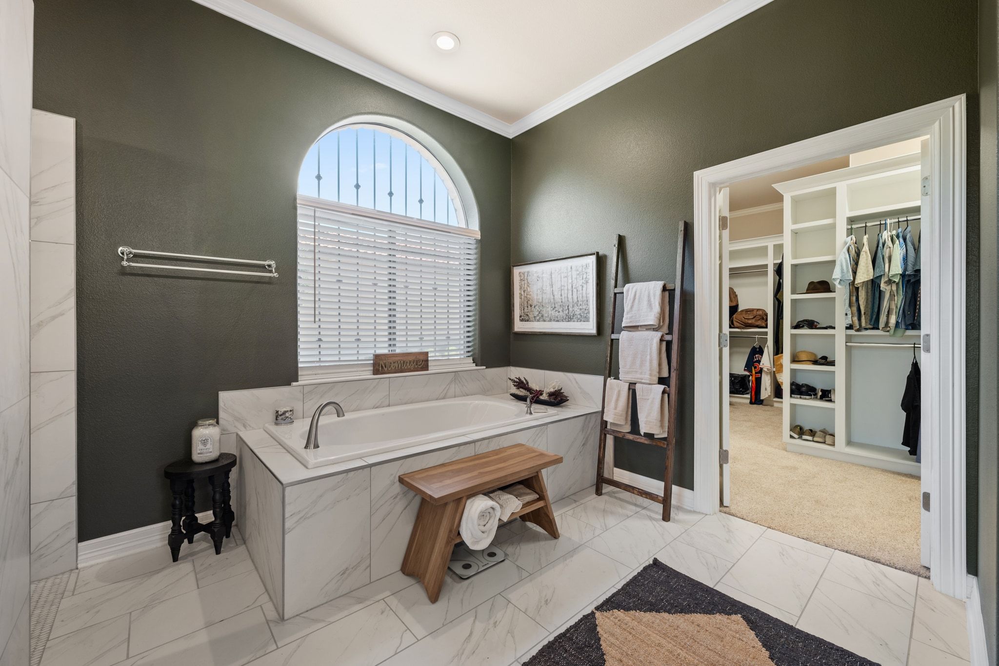 185 Shimmering Shore Court Spring Branch, TX 78070 - Photo 17 of 36 Full bath with a garden tub, a spacious closet, ornamental molding, and light marble finish floors