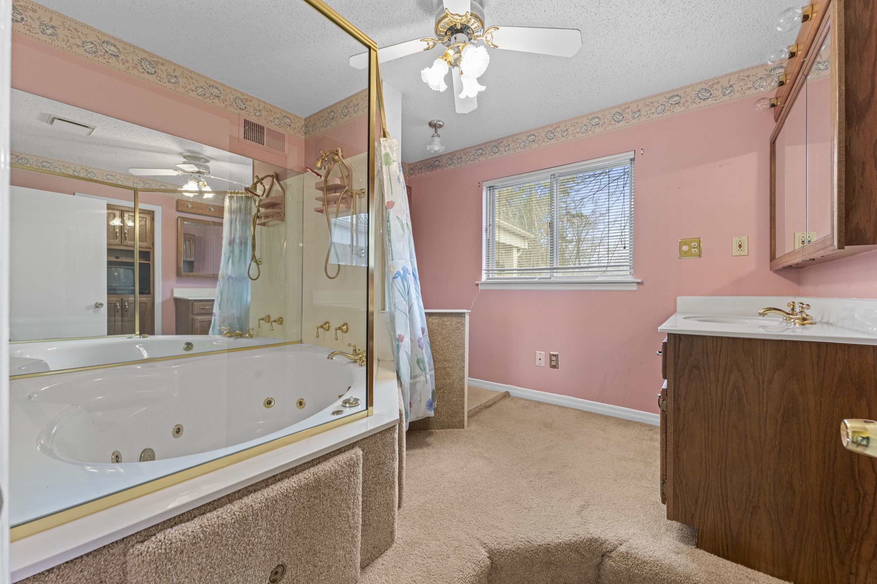 319 Homeville Road Collierville, TN 38017 - Photo 18 of 21 a bathroom with a bathtub shower sink and mirror