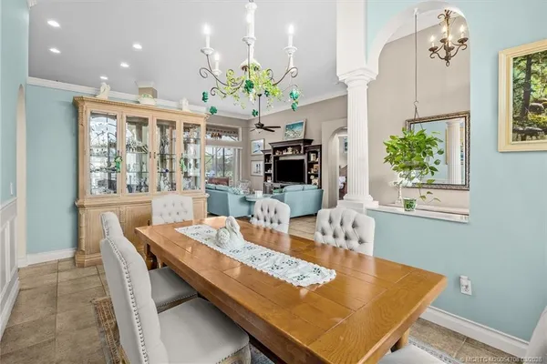 a bedroom with a bed and dresser with mirror