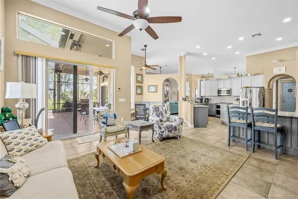 a aerial view of a house with a yard and lake view