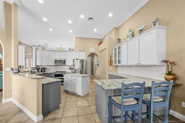 an aerial view of a house with a yard and lake view