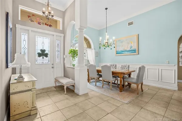 a work room with furniture and a window