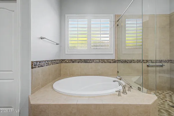 a white bath tub sitting next to a window