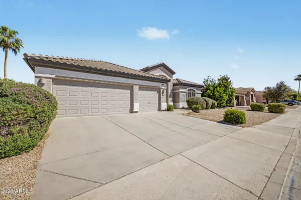 a house with yard and parking space