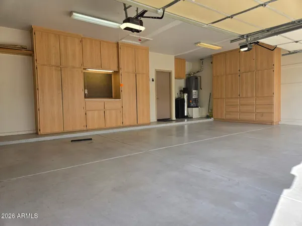 a view of an empty room with a cabinet