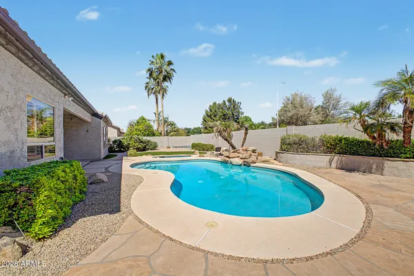a view of swimming pool with outdoor seating