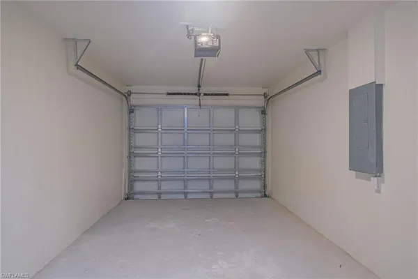 a view of a store room cabinets and empty racks