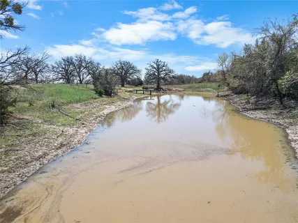 a view of lake with a yard