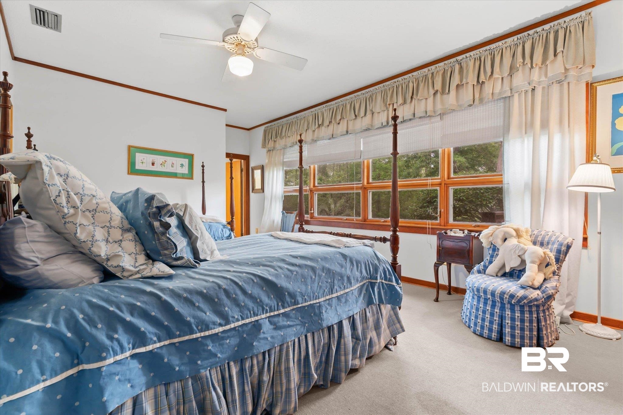 3500 Venetia Road Mobile, AL 36605 - Photo 23 of 56 Bright bedroom featuring a large multi-pane window with wood-finish trim, light-colored carpet, and a ceiling fan