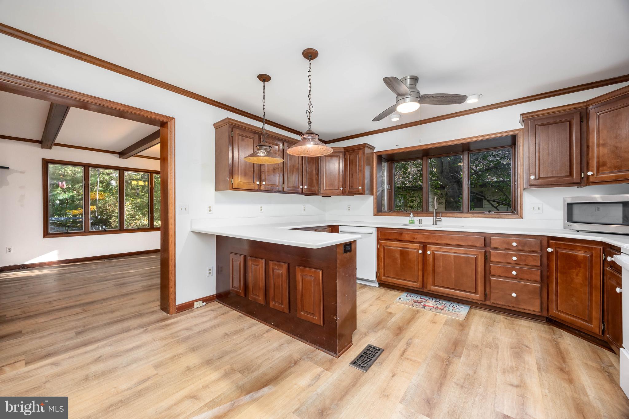 19 Brookside Road Ocean Pines, MD 21811 - Photo 14 of 80 a kitchen with stainless steel appliances kitchen island granite countertop a stove a sink and a wooden cabinets