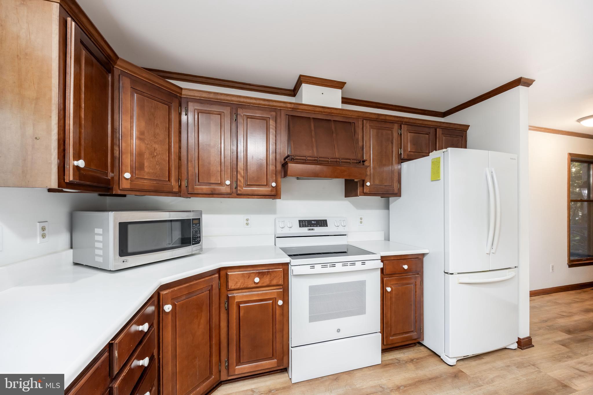 19 Brookside Road Ocean Pines, MD 21811 - Photo 17 of 80 a kitchen with stainless steel appliances granite countertop a refrigerator sink and stove