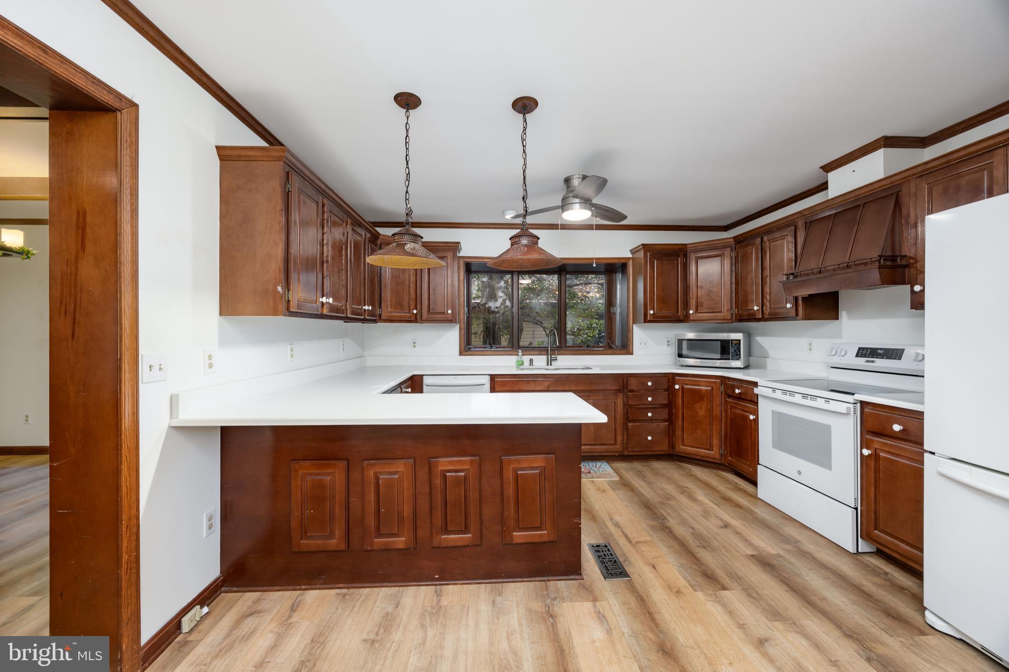 19 Brookside Road Ocean Pines, MD 21811 - Photo 19 of 80 a kitchen with stainless steel appliances granite countertop a sink a stove and a refrigerator