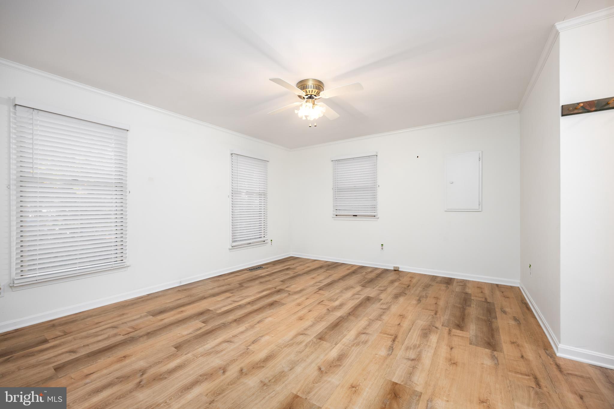 19 Brookside Road Ocean Pines, MD 21811 - Photo 22 of 80 a view of empty room with wooden floor and fan