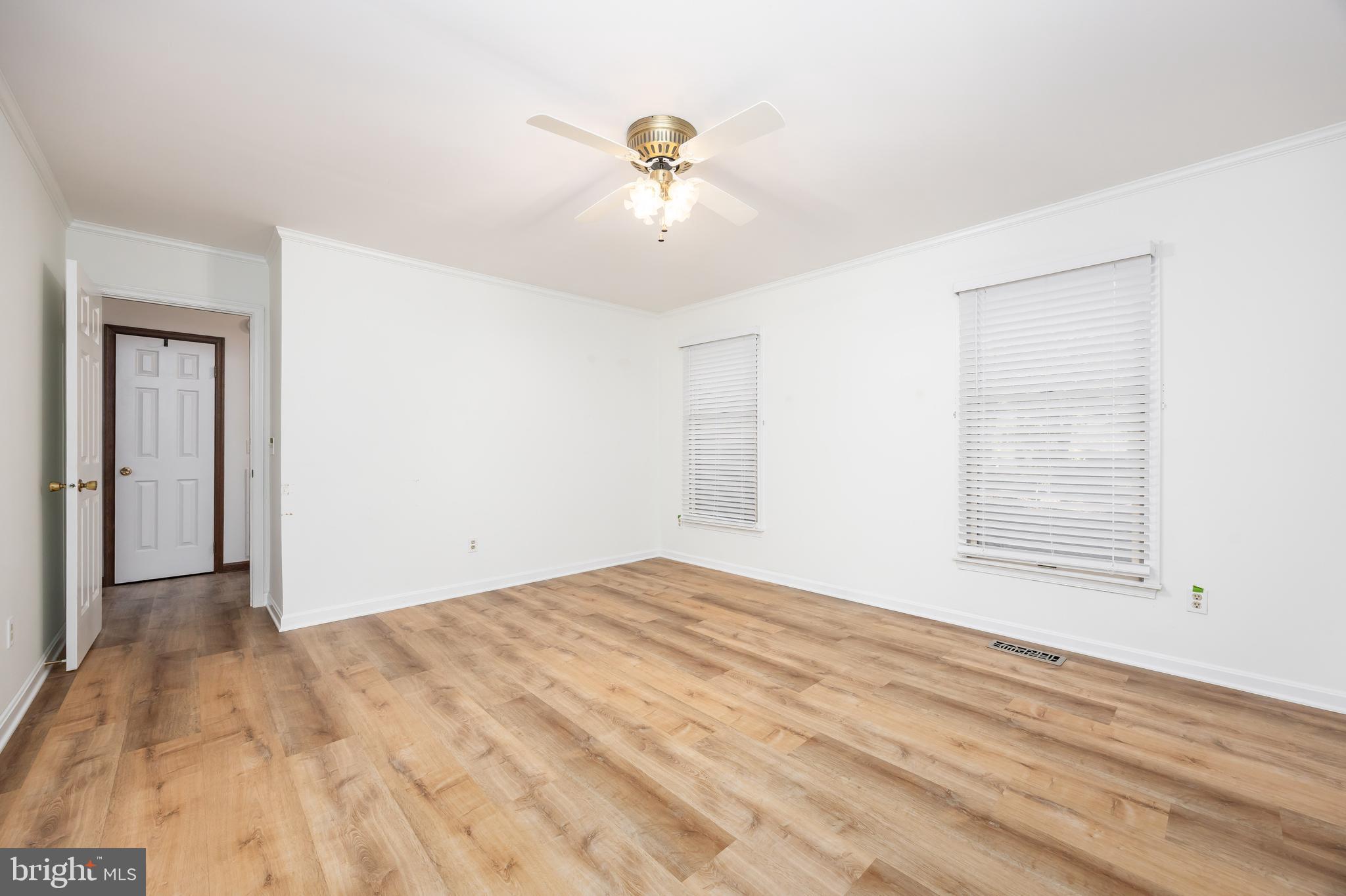 19 Brookside Road Ocean Pines, MD 21811 - Photo 25 of 80 a view of an empty room with wooden floor and a window