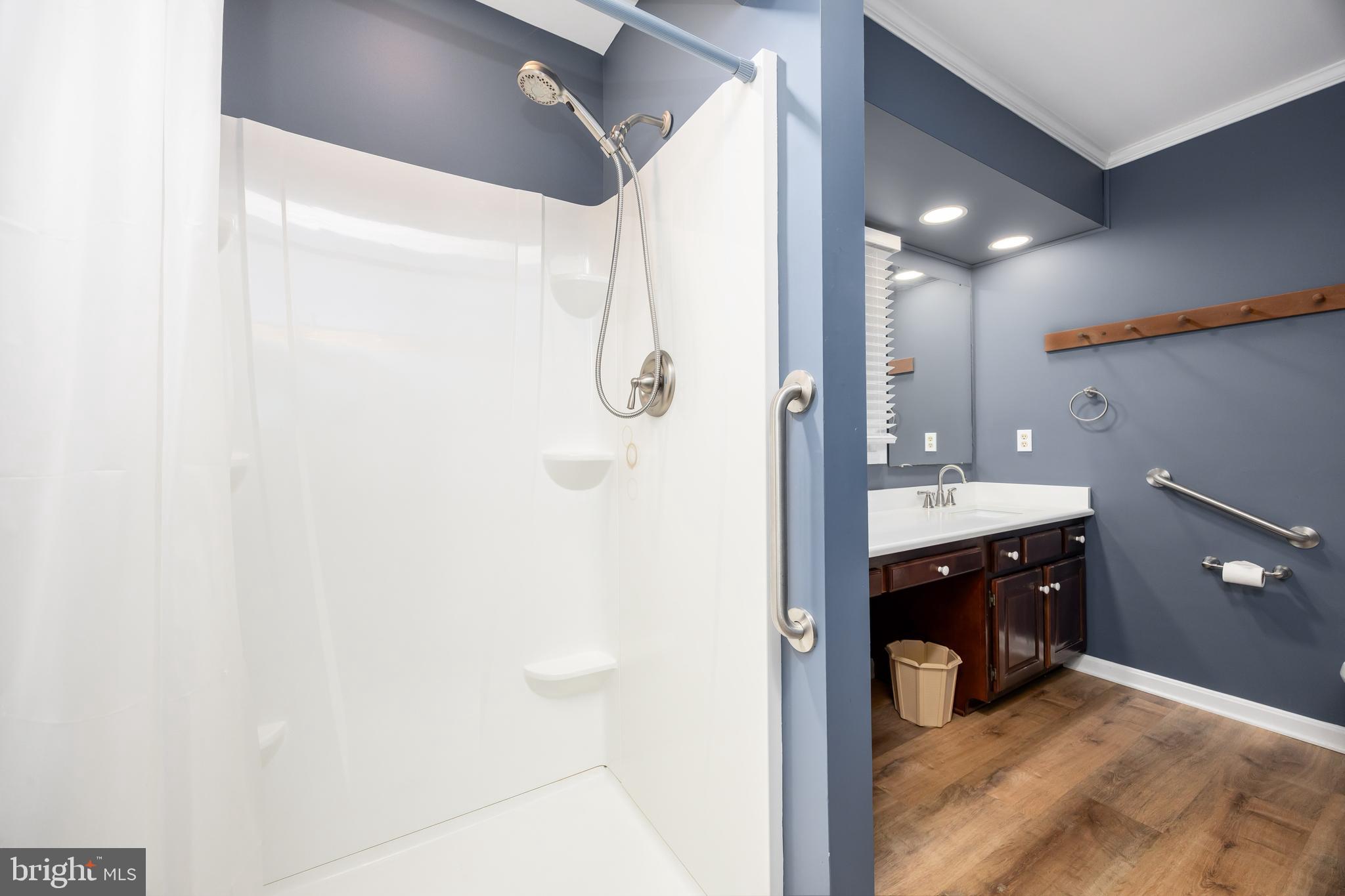 19 Brookside Road Ocean Pines, MD 21811 - Photo 30 of 80 a bathroom with a sink shower and a mirror