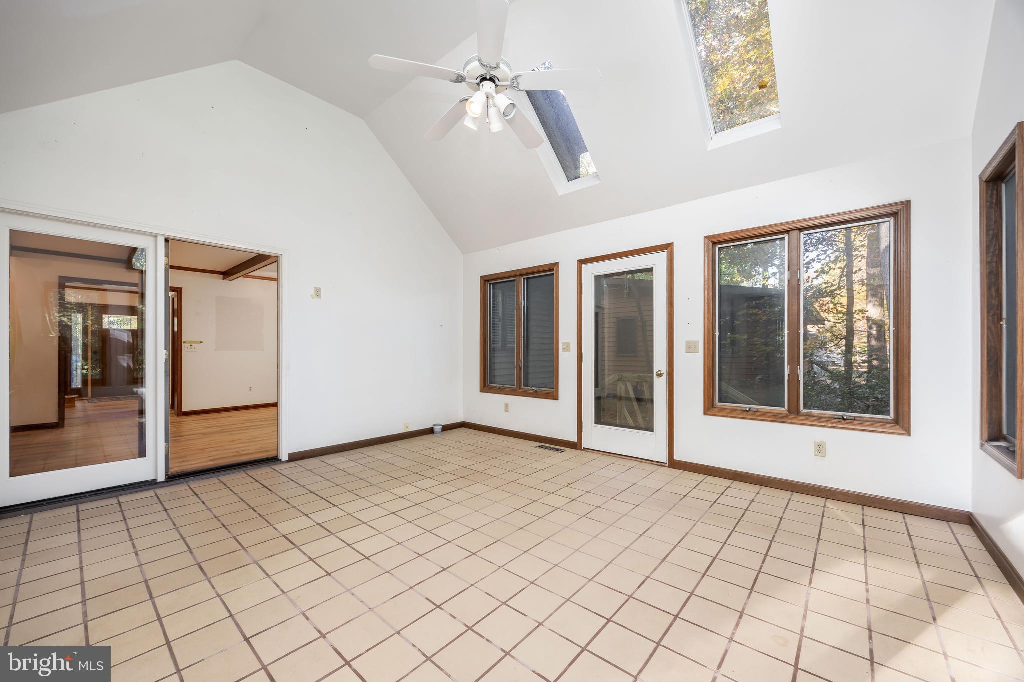 19 Brookside Road Ocean Pines, MD 21811 - Photo 33 of 80 a view of an empty room with window and chandelier