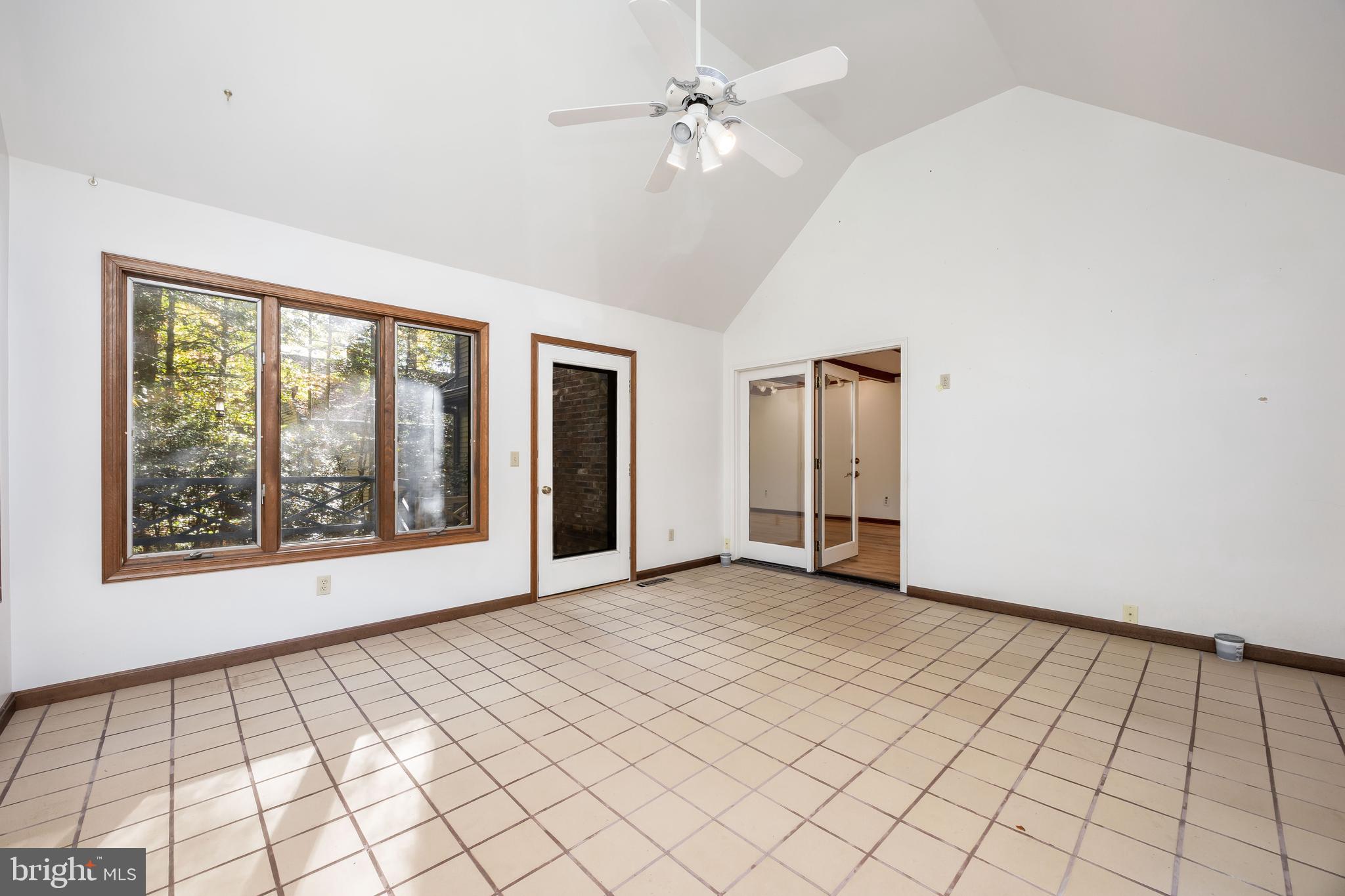19 Brookside Road Ocean Pines, MD 21811 - Photo 34 of 80 a view of an empty room with window and chandelier fan