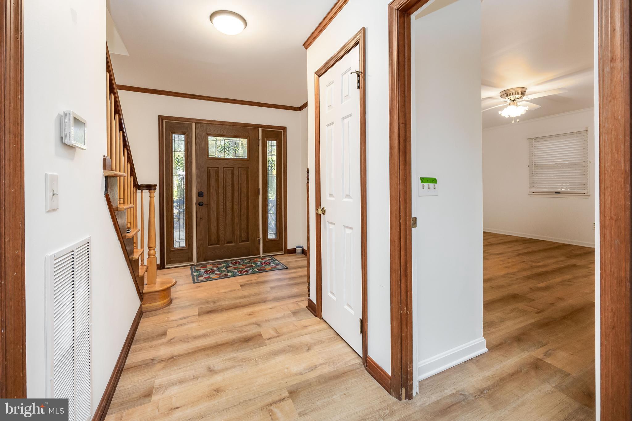 19 Brookside Road Ocean Pines, MD 21811 - Photo 5 of 80 a view of a hallway with wooden floor and staircase
