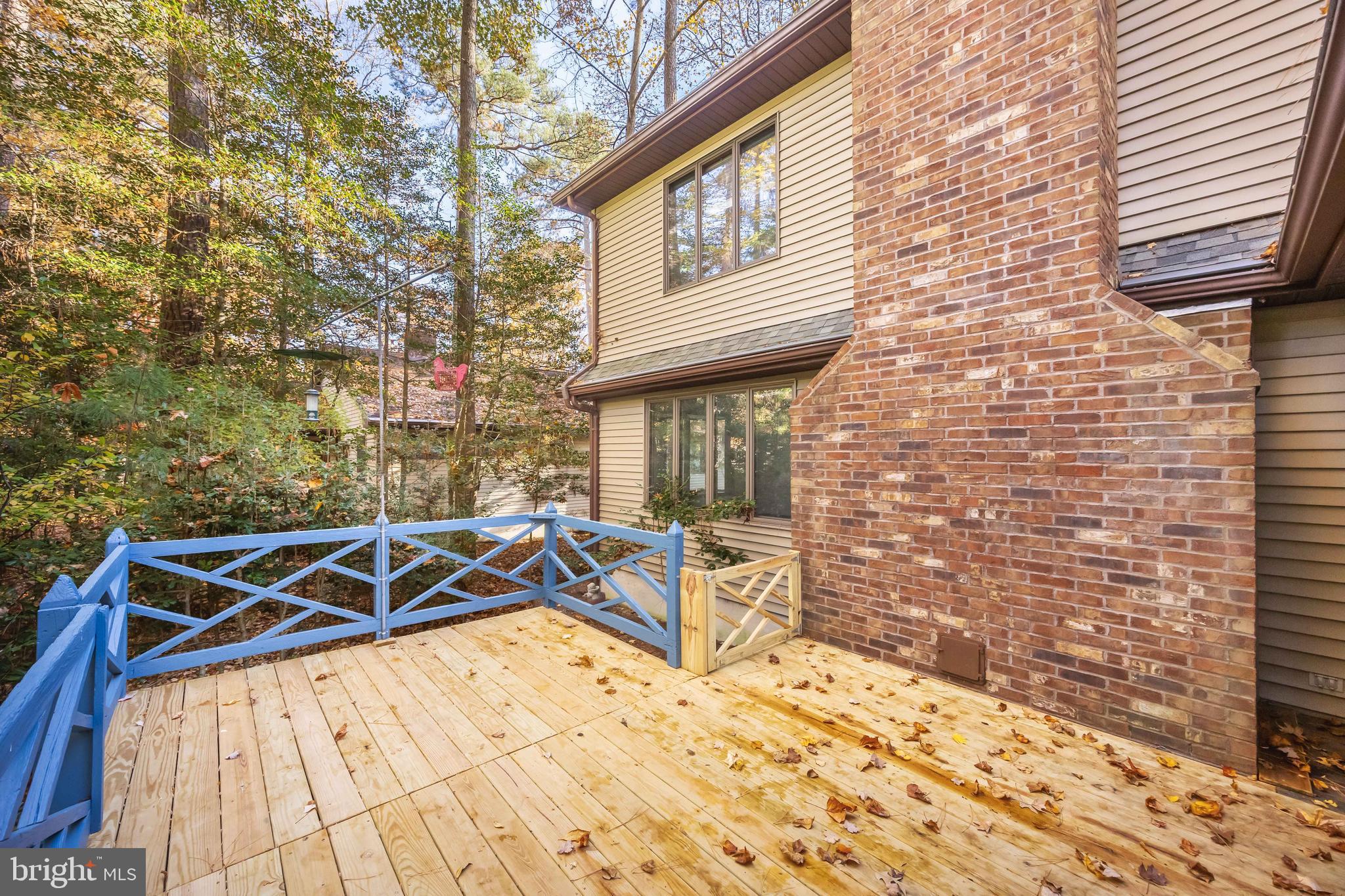 19 Brookside Road Ocean Pines, MD 21811 - Photo 69 of 80 a view of a patio with table and chairs with wooden floor and fence