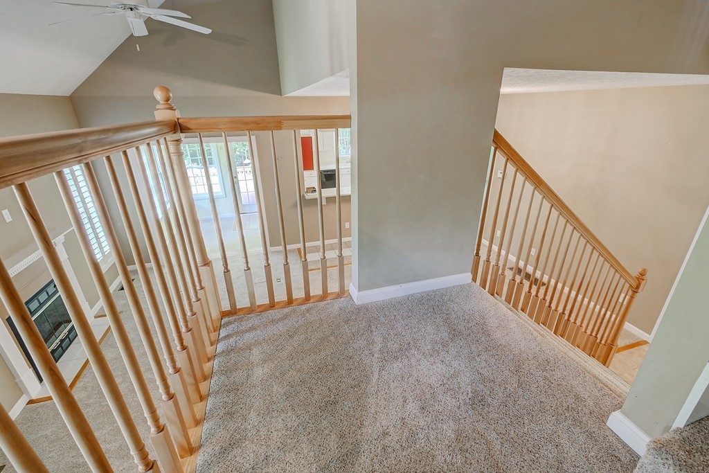 4 Old Stage Road, Unit 4 Litchfield, NH 03052 - Photo 22 of 30 a view of a hallway view with staircase and rug