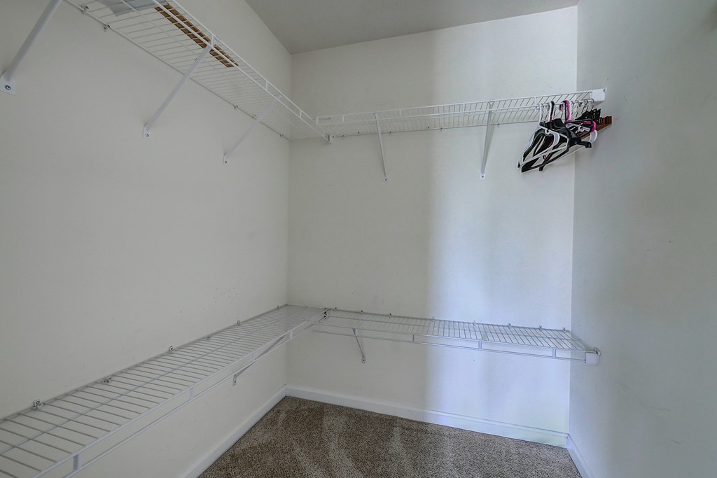 4 Old Stage Road, Unit 4 Litchfield, NH 03052 - Photo 27 of 30 a view of a room with racks on the wall
