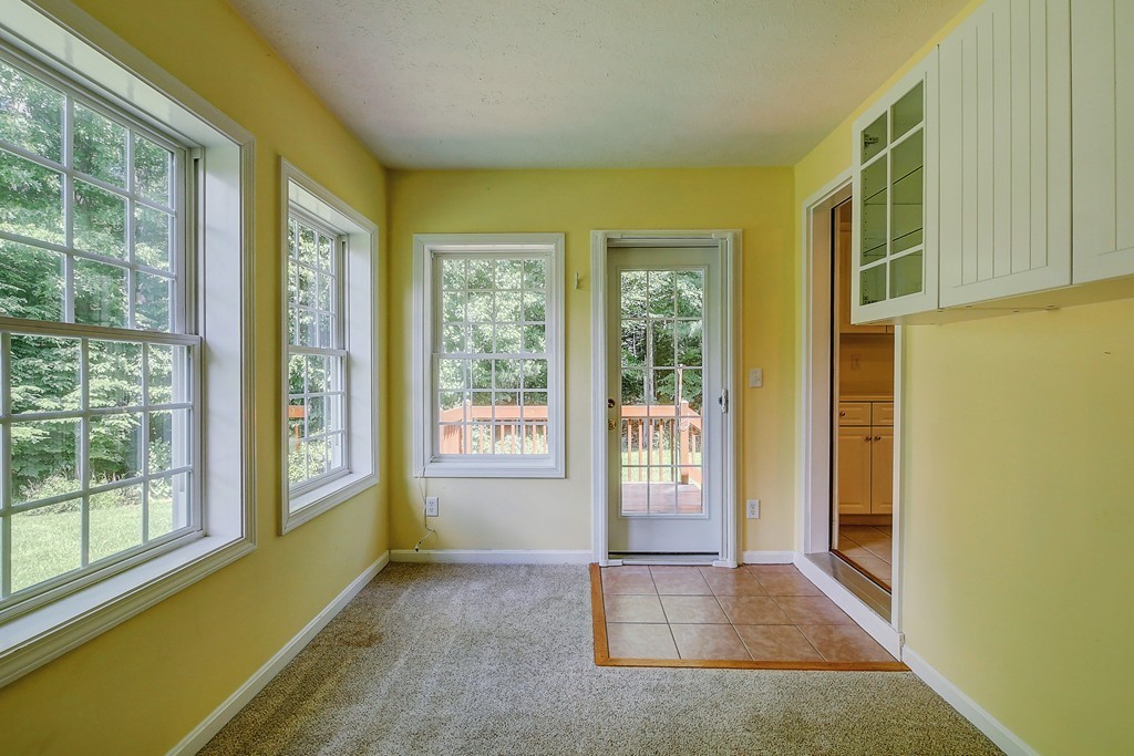 4 Old Stage Road, Unit 4 Litchfield, NH 03052 - Photo 8 of 30 a view of an empty room with a window