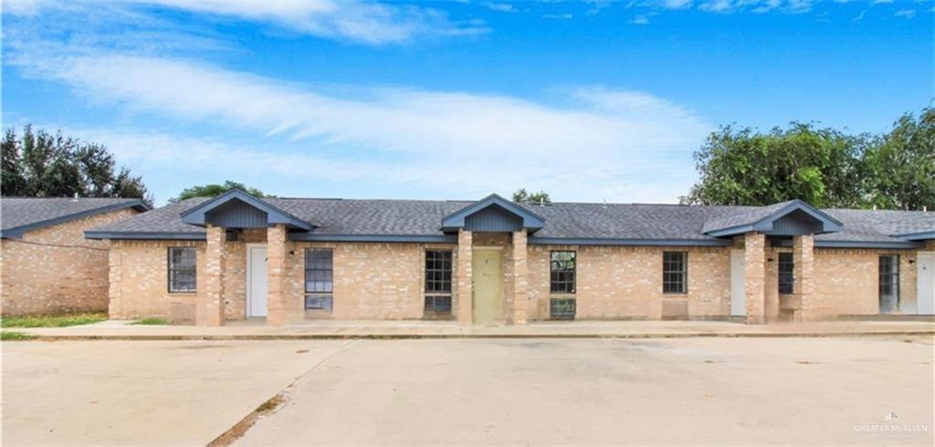 2612 West 17 1/2 Street, Unit 9 McAllen, TX 78504 - Photo 1 of 13 front view of a house with a garden