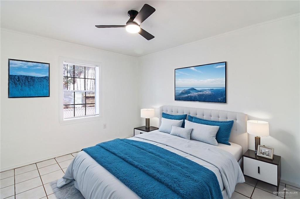 2612 West 17 1/2 Street, Unit 9 McAllen, TX 78504 - Photo 7 of 13 a bedroom with a bed and a painting on the wall