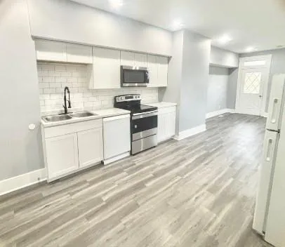 a view of a kitchen with a sink and dishwasher kitchen view